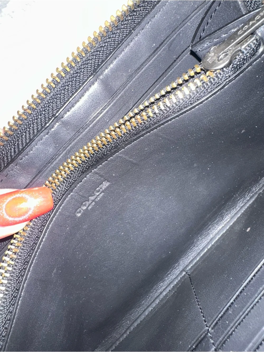 Coach accordion zip